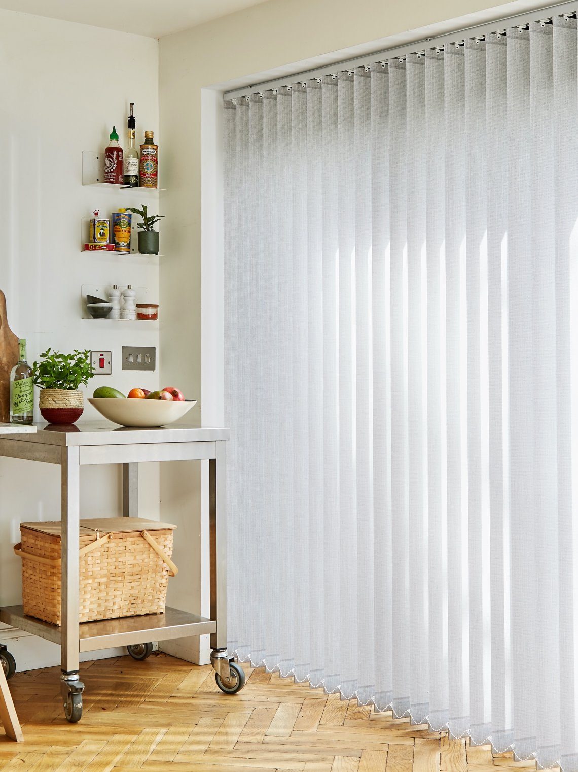 Custom vertical shades installed in a bright kitchen
